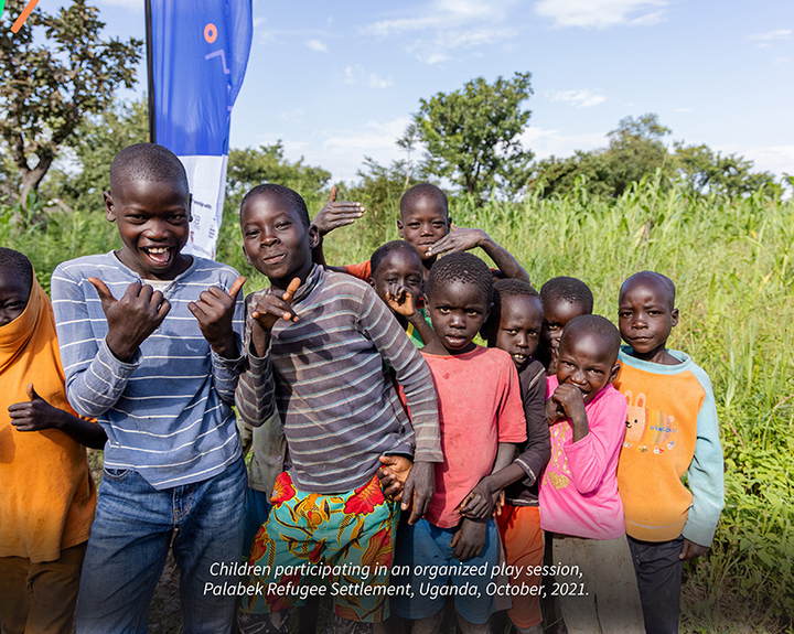 Children playing rope skipping game during an organised Play Session, Palabek Refugee Settlement, Uganda, October, 2021