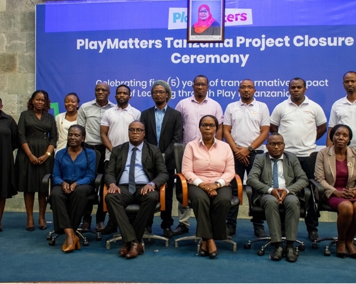 PlayMatters consortium staff and government officials pose for a photo at the event.