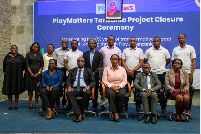 PlayMatters consortium staff and government officials pose for a photo at the event.