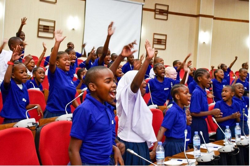 Students from Victoria Primary School, Dar es Salaam, singing at the event.