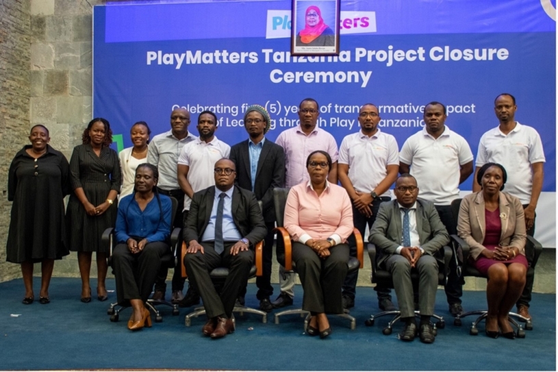PlayMatters consortium staff and government officials pose for a photo at the event.